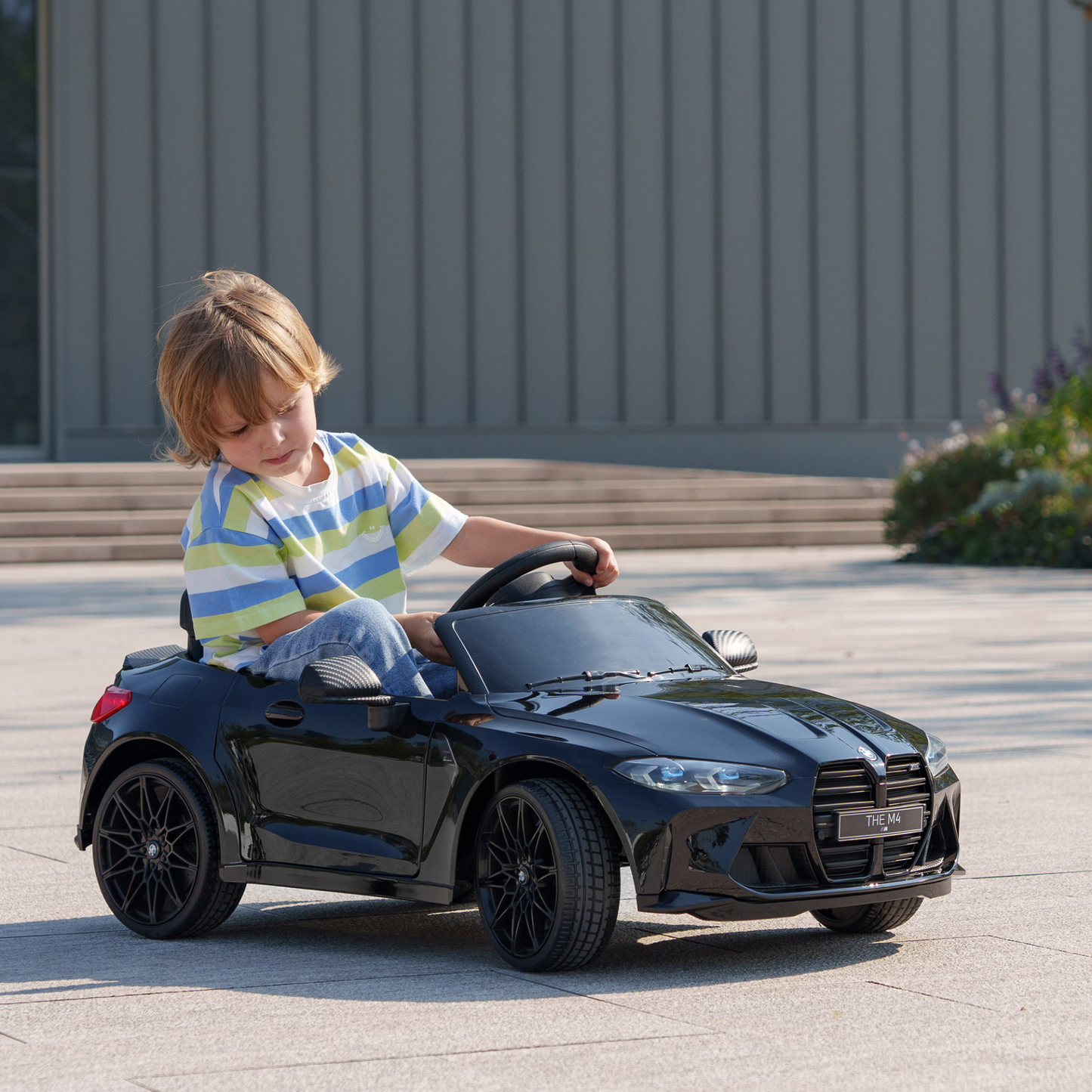 12V BMW M4 Licensed Kids Car with Easy Transport, Remote Control, Suspension, Music, Horn, LED Lights - Black by AIYAPLAY